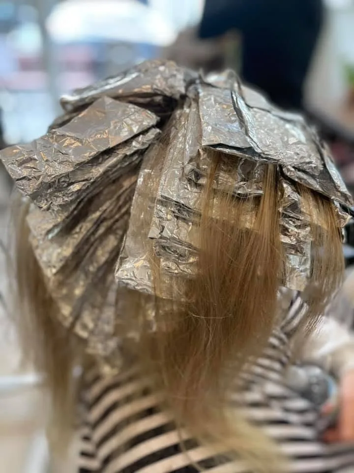 Close-up of gold-brown foils packed across a crown, mid-development
